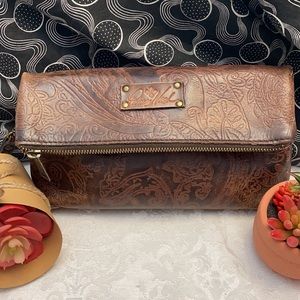 Patricia Nash Embossed Floral Fold-over Clutch.